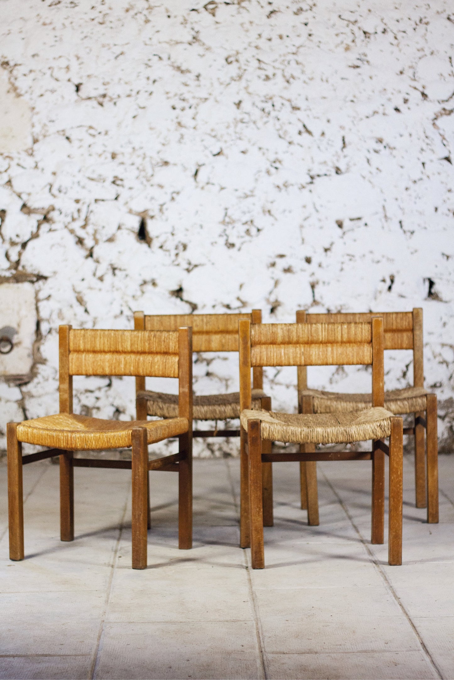 4 chaises en paille "Week-end" par Pierre Gauthier Delaye, 1950