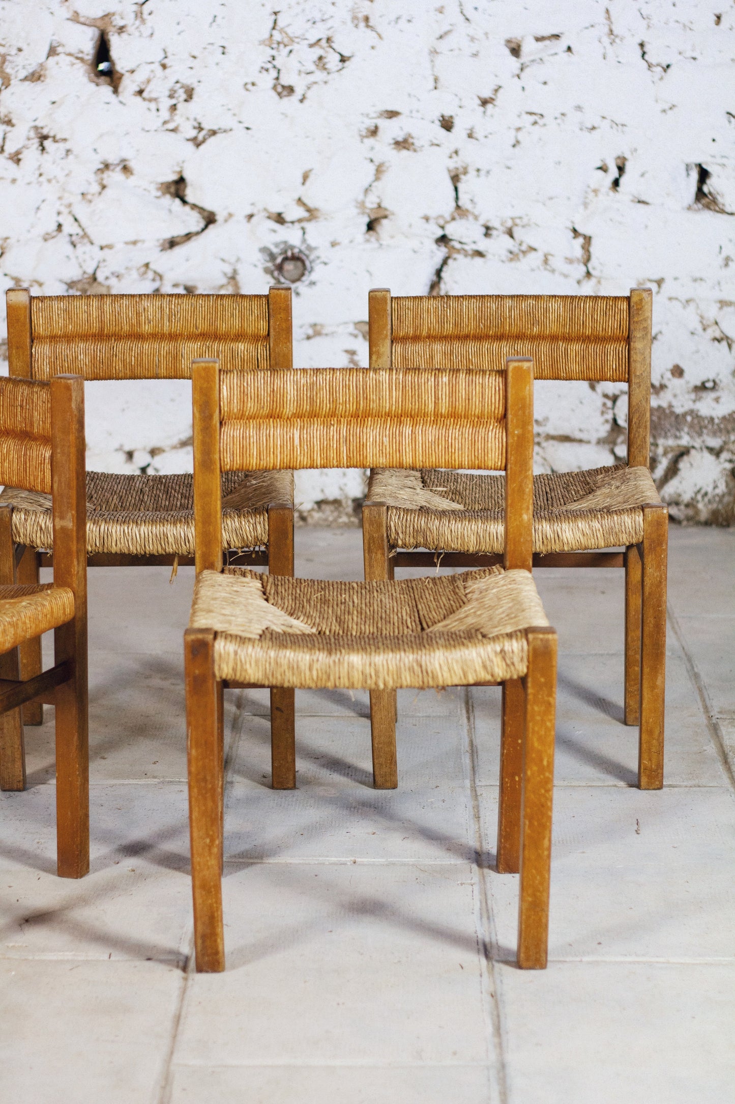 4 chaises en paille "Week-end" par Pierre Gauthier Delaye, 1950