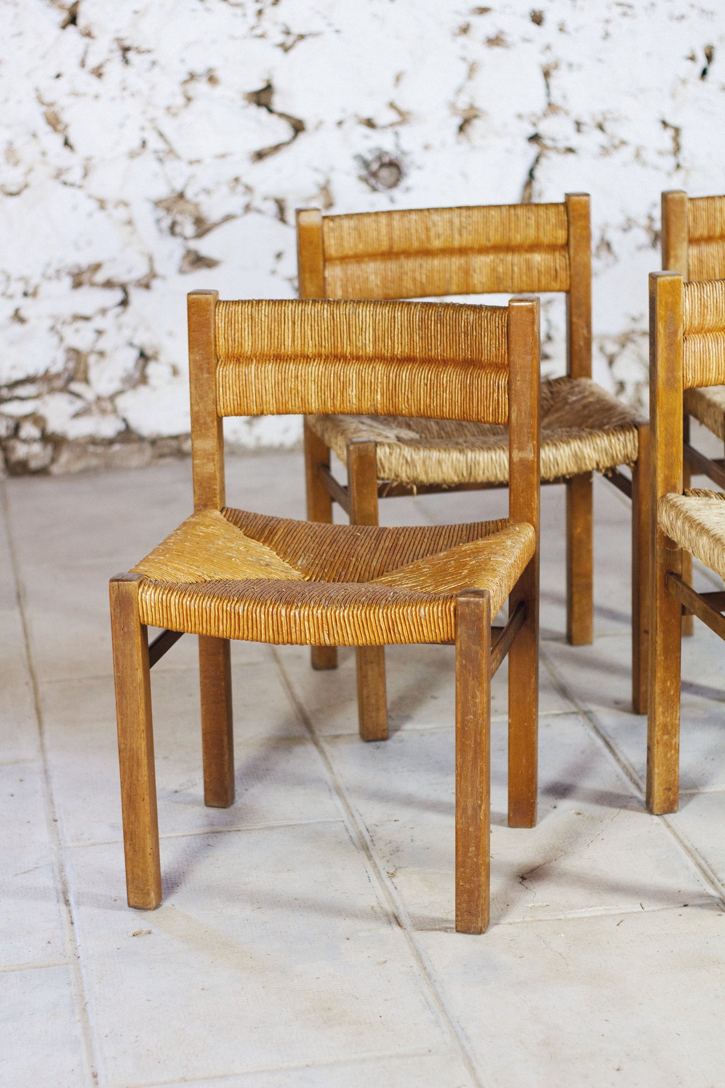 4 chaises en paille "Week-end" par Pierre Gauthier Delaye, 1950