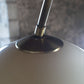Lampadaire arc par Harvey Guzzini en laiton, 1970